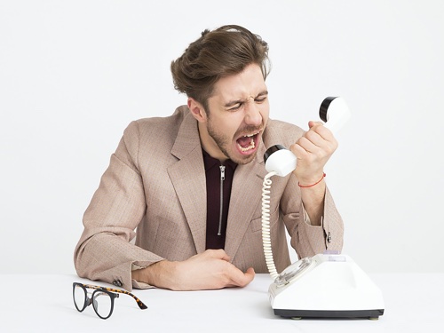 A man screaming in a phone